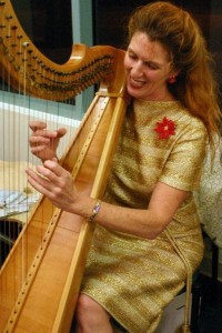 Bonnie with harp at Xmas